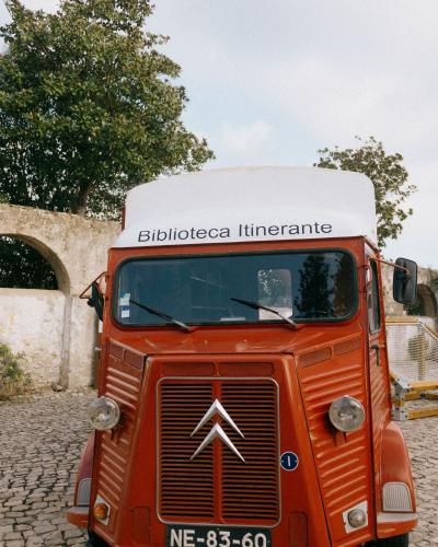 Classic Citroen van converted into a mobile library in Óbidos, Portugal.