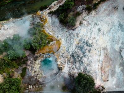 Steaming geothermal springs and turquoise pool at Furnas, Sao Miguel, Azores