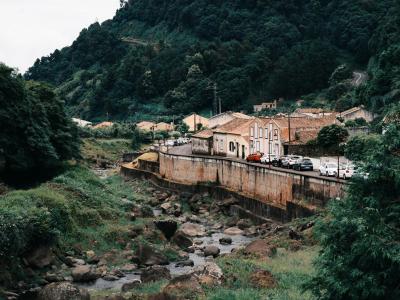 Village and green hills near the Salto do Prego hiking trail, Sao Miguel, Azores