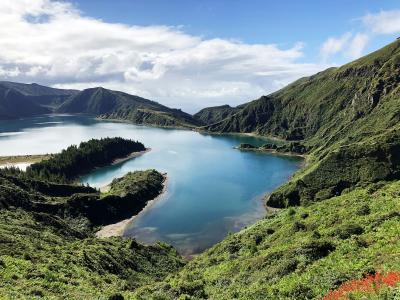Lagoa do Fogo crater lake surrounded by emerald green hills on Sao Miguel, Azores