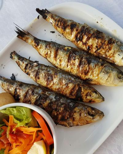 Plate of grilled sardines, a traditional Portuguese dish