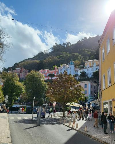 Wide street with guesthouses and hillside views in Sintra, Portugal