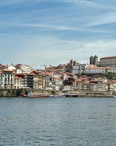 Ribeira waterfront and Porto Cathedral seen across the Douro River