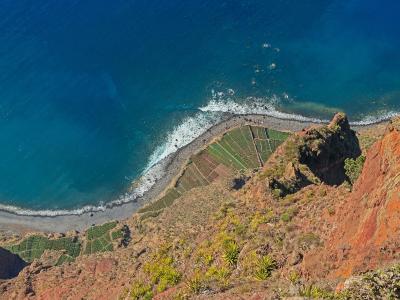 View from the Cabo Girao Skywalk over the Atlantic and faja fields, Madeira