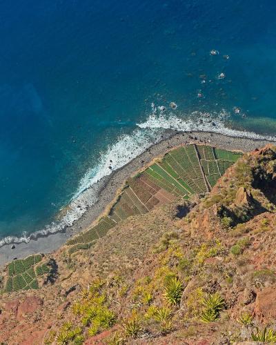 View from the Cabo Girao Skywalk over the Atlantic and faja fields, Madeira
