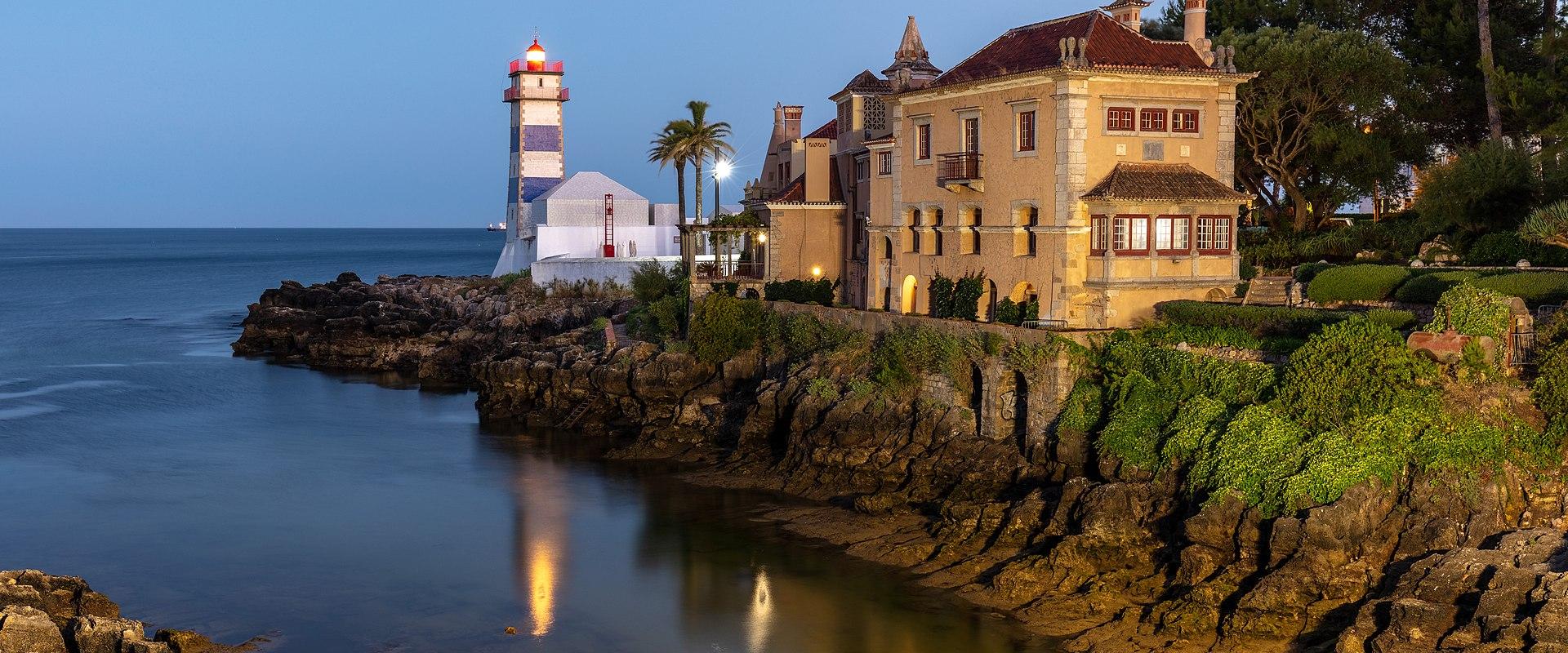 Small Cove With Blue Stripy Lighthouse