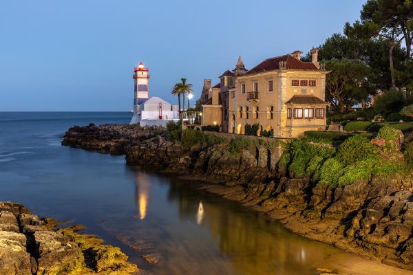 Small Cove With Blue Stripy Lighthouse
