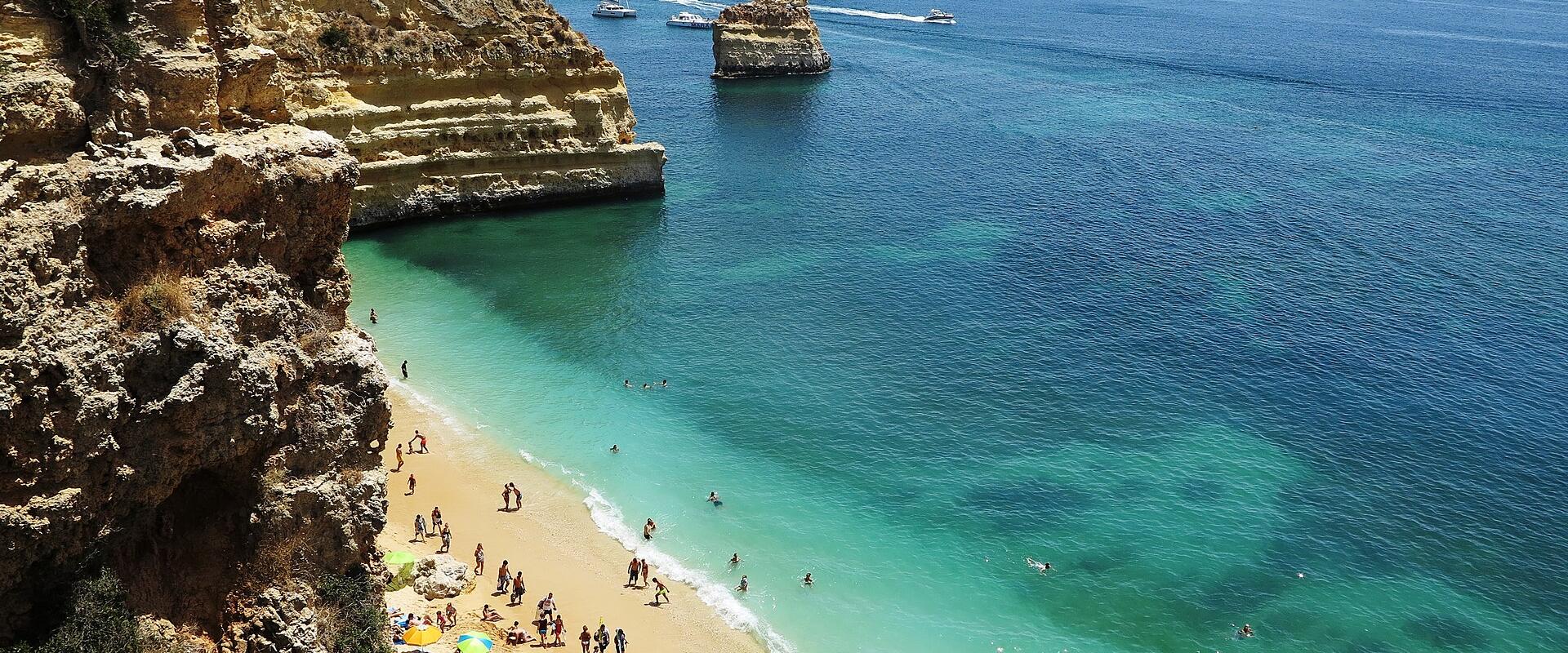 Golden cliffs and turquoise water at Praia da Marinha in the Algarve