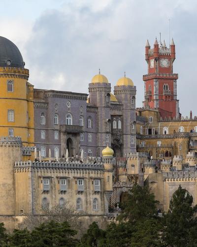 Pena Palace rising above the forested hills of Sintra, Portugal