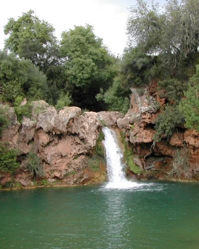 The waterfall and green pool of Pego do Inferno near Tavira
