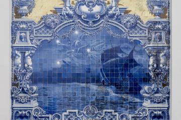 A large blue-and-white azulejo tile panel depicting a sailing ship under a night sky with stars, framed by ornate architectural motifs and inscribed with "CRUZEIRO DO SUL" at the bottom.