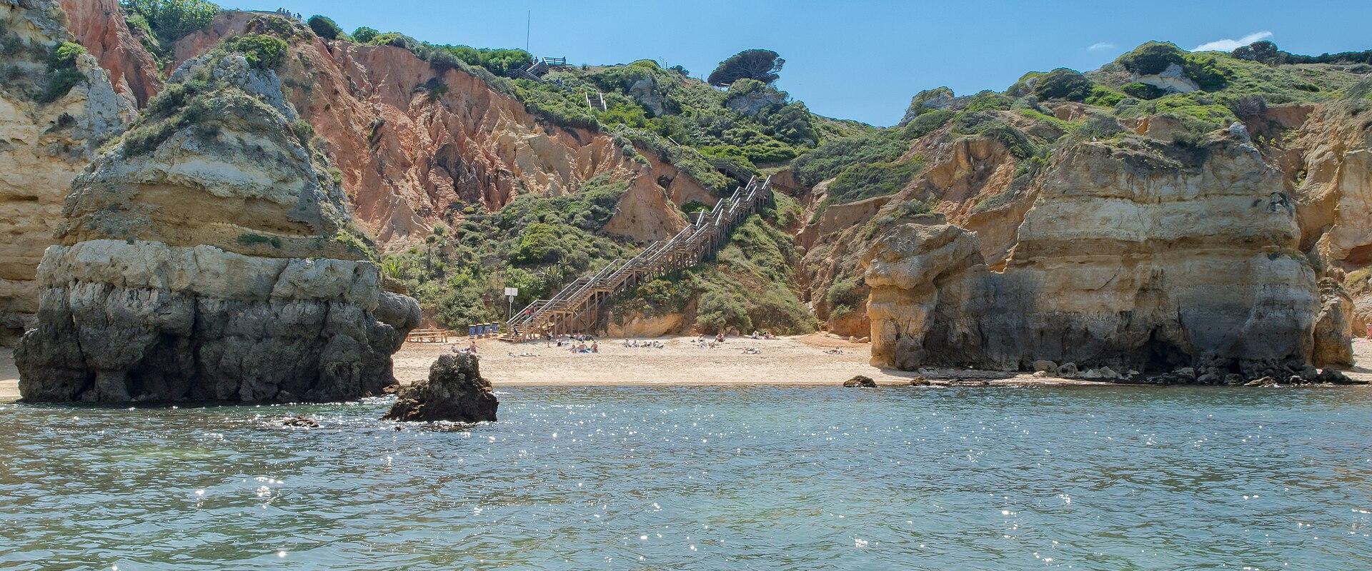 Praia do Camilo cove between golden cliffs near Lagos