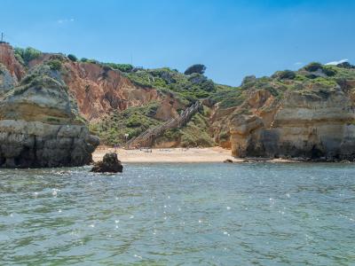 Praia do Camilo cove between golden cliffs near Lagos