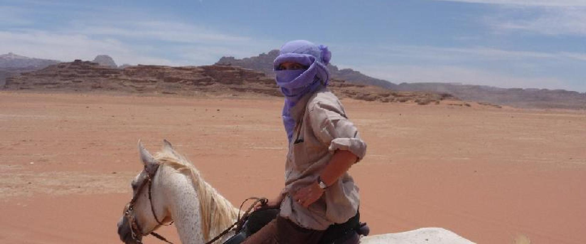 Horseriding tourist in sahara