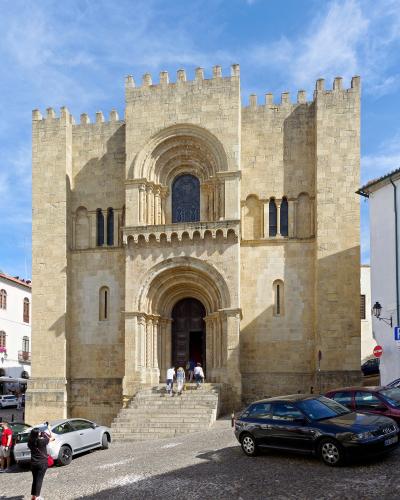 Fortress-like Romanesque facade of the Old Cathedral (Se Velha) in Coimbra, Portugal