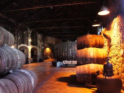 Port wine barrels in the Burmester lodge cellars in Vila Nova de Gaia, Porto