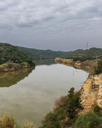 The Guadiana river winding between hills along the Portugal–Spain border