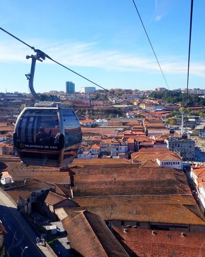 Teleferico de Gaia cabin above Vila Nova de Gaia rooftops and the Douro River, Porto