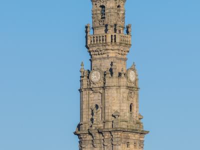 Baroque Torre dos Clerigos bell tower rising above rooftops in Porto, Portugal