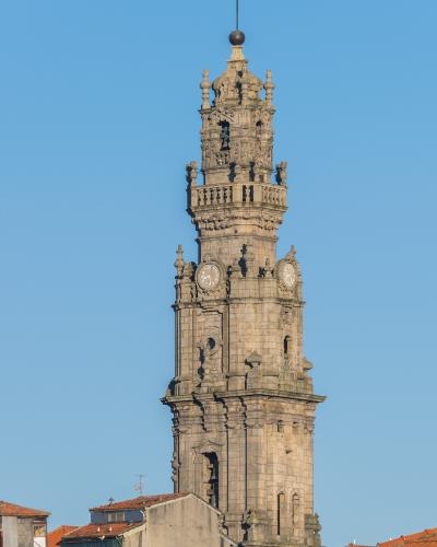 Baroque Torre dos Clerigos bell tower rising above rooftops in Porto, Portugal