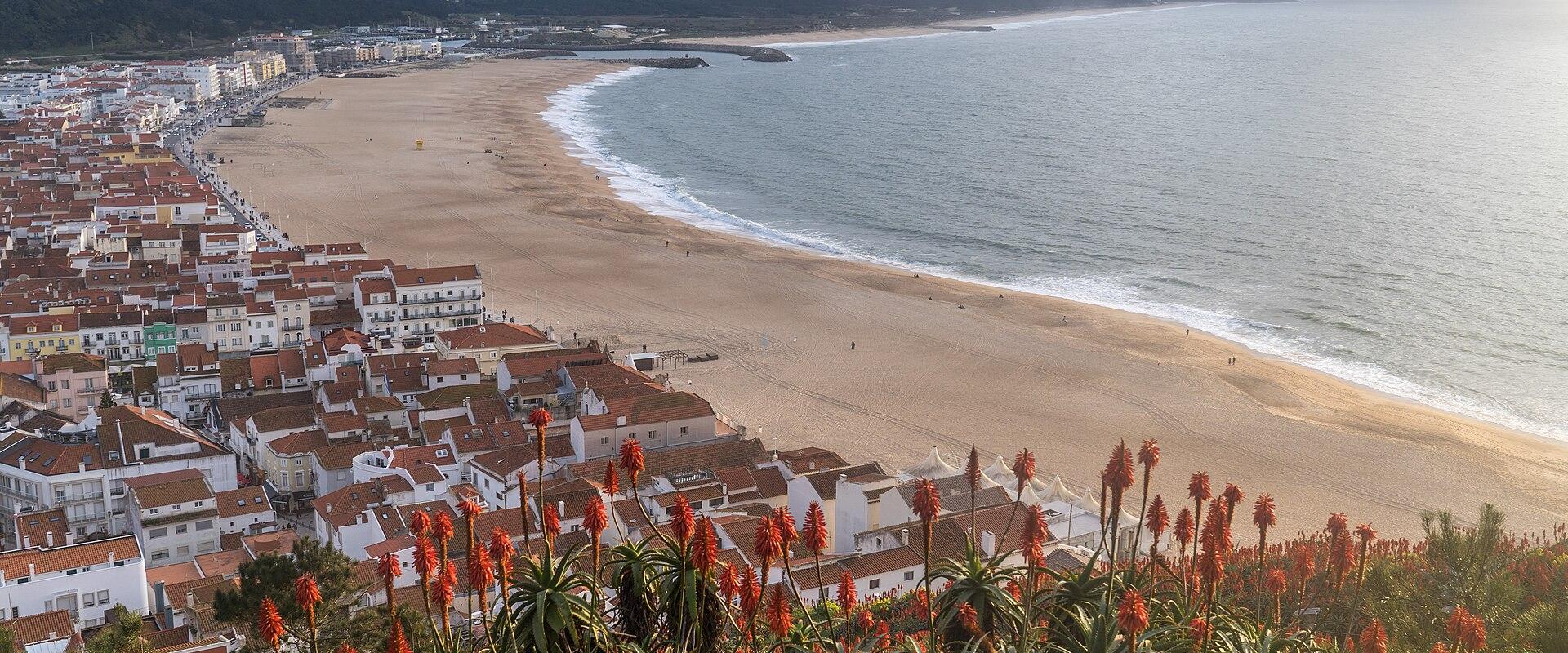 Nazaré town and its long beach seen from the clifftop of Sítio