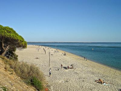 The sandy sweep of Praia da Figueirinha in the Arrábida natural park