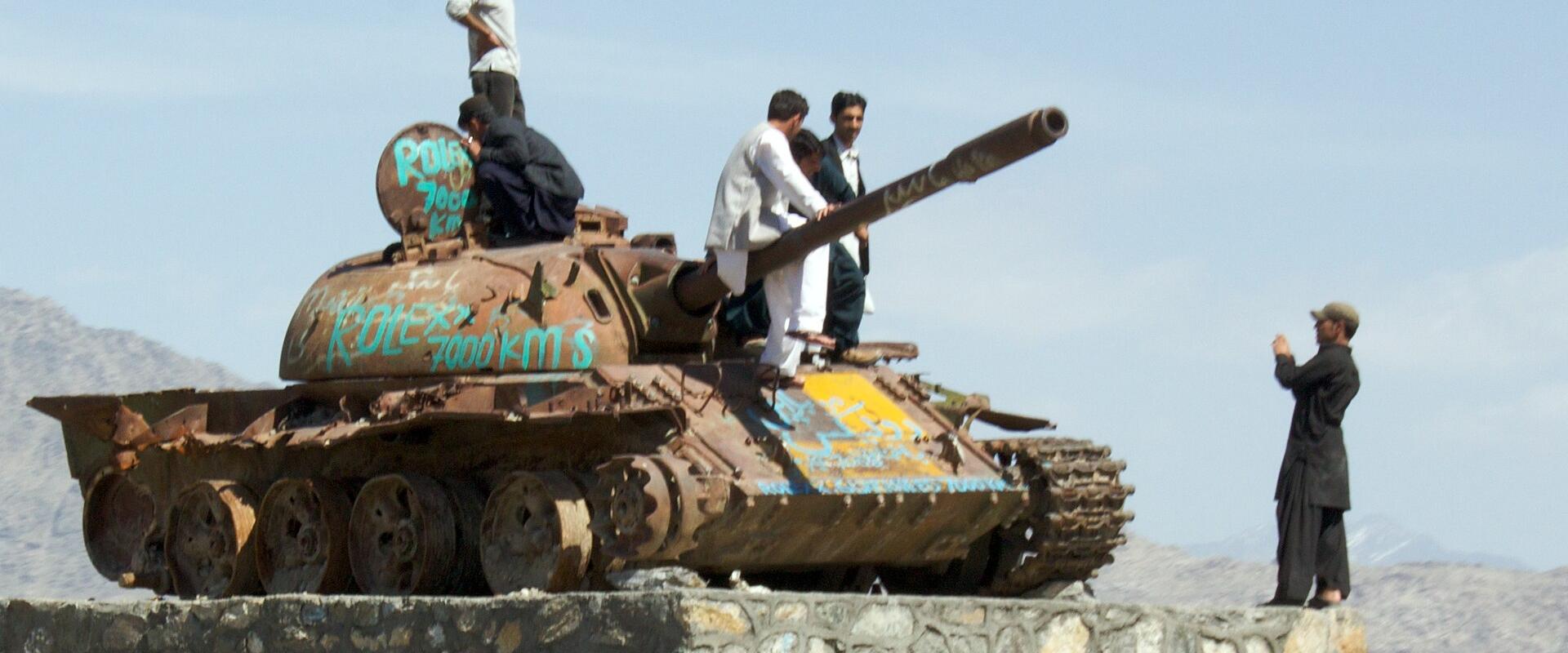 Destroyed T-55A tank adapted into a tourist attraction in Afghanistan