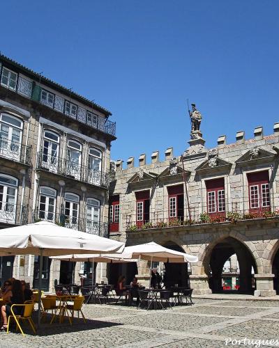 Largo da Oliveira square and old town hall in the medieval center of Guimaraes, Portugal