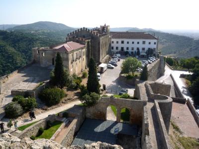Palmela Castle with its keep and the pousada in the former convent, above wooded hills