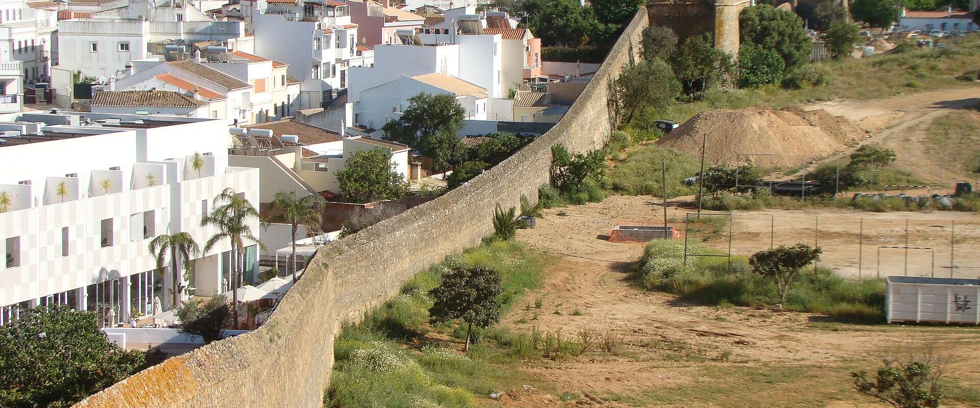 Old city walls of Lagos running past the town
