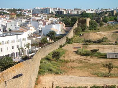 Old city walls of Lagos running past the town