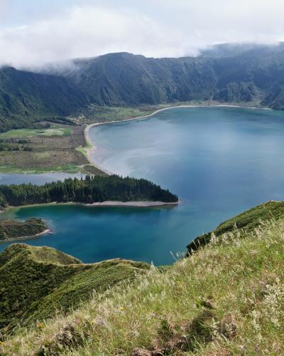 Lagoa do Fogo crater lake with its sandy spit, seen from the caldera rim on São Miguel