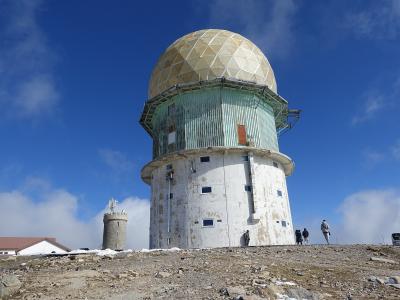 The domed radar towers at Torre, the summit of Serra da Estrela, under a blue sky
