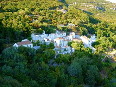The white Convento da Arrábida on the wooded slopes of the Serra da Arrábida