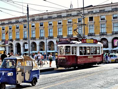 Tuk tuk and historic tram in Praca do Comercio, Lisbon
